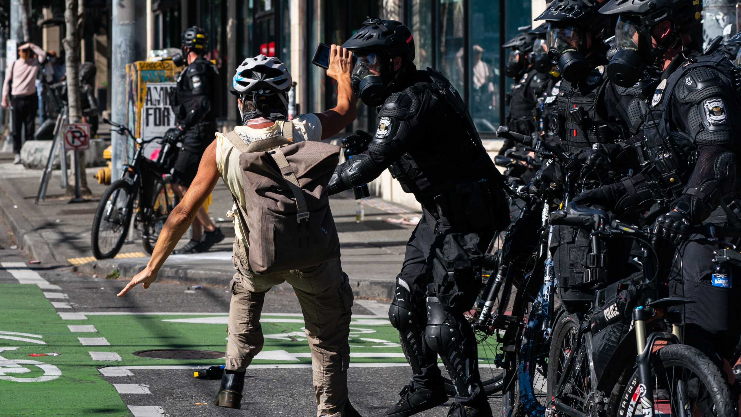 Police push a demonstrator to the ground during protests on July 25, 2020, in Seattle, Washington. (David Ryder/Getty Images)