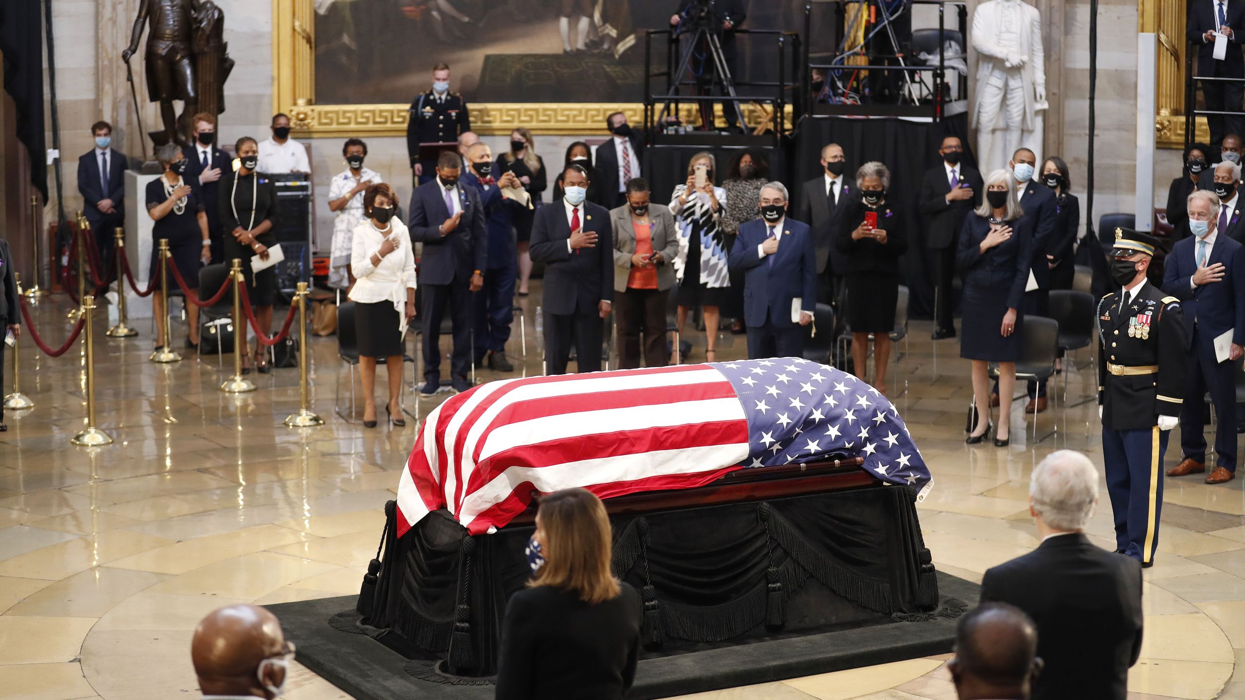 The flag-draped casket of the late Rep. John Lewis, D-GA, is carried by a joint services military honor guard, as he arrives to lie in state in the Rotunda of the US Capitol in Washington, DC, on July 27, 2020. (SHAWN THEW/POOL/AFP via Getty Images)