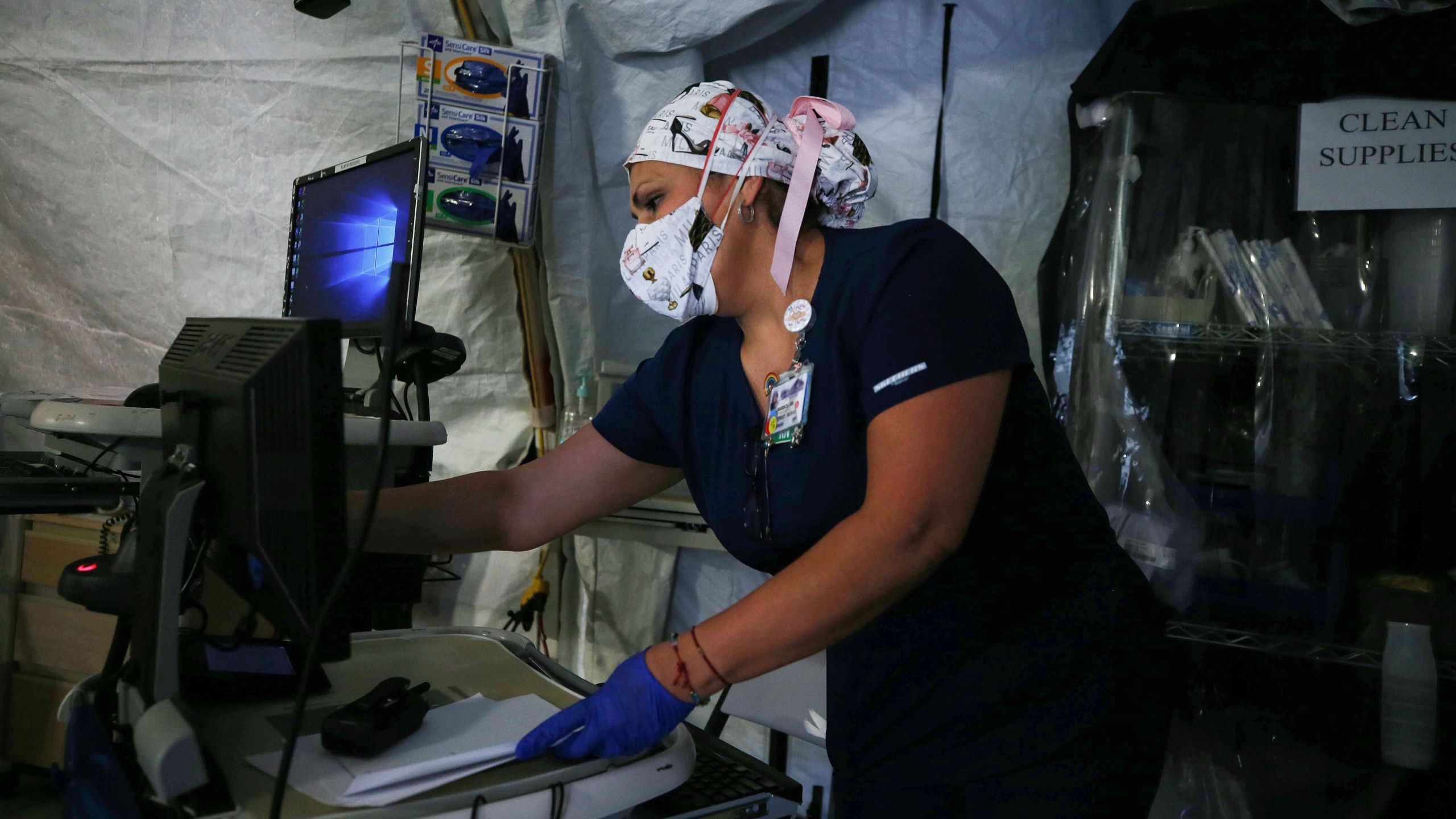 A nurse works in a makeshift tent triage center for patients suspected of being COVID-19 positive outside El Centro Regional Medical Center in hard-hit Imperial County on July 21, 2020. (Mario Tama/Getty Images)