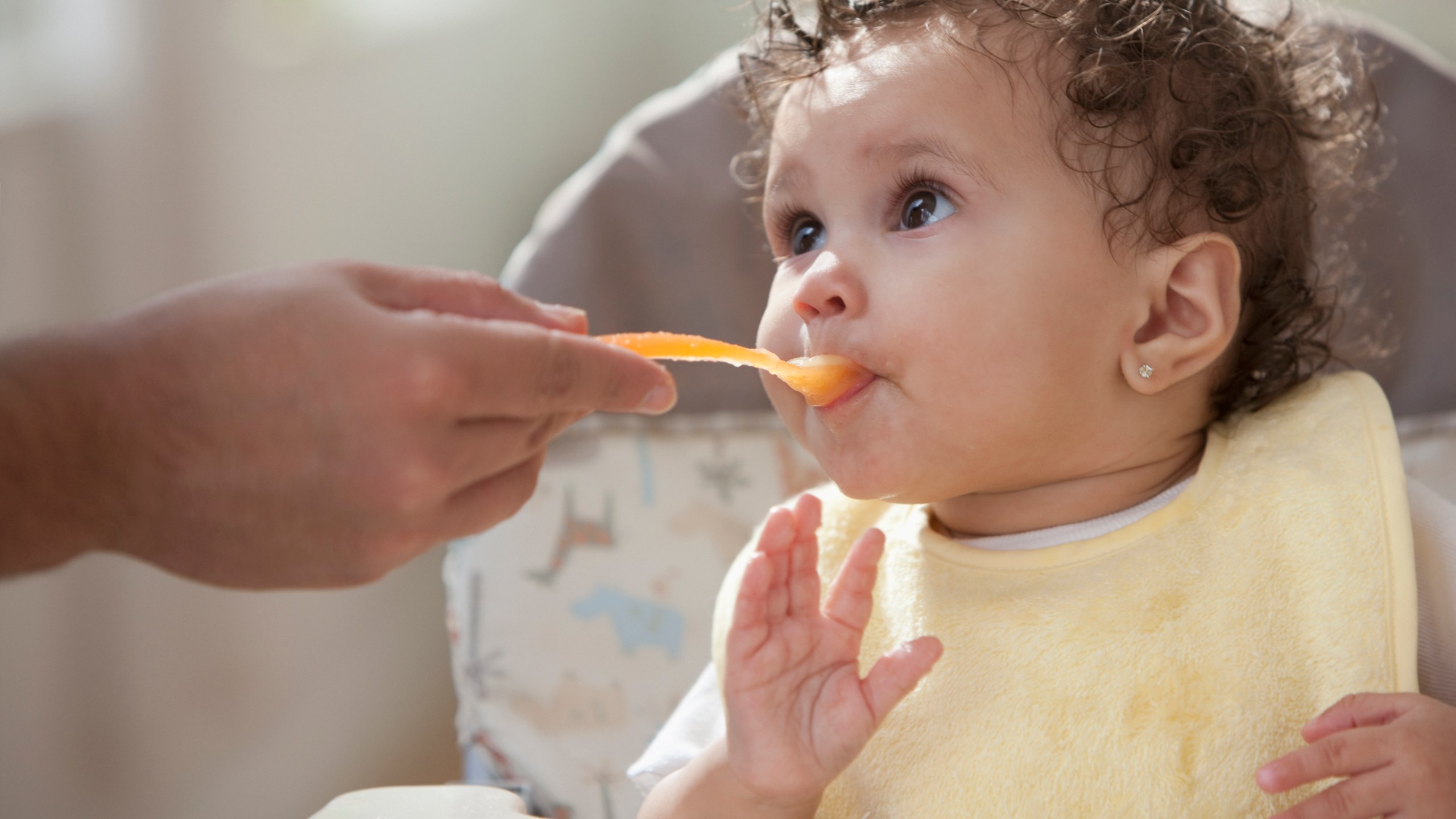 A parent feeds a baby in this file photo. (Getty Images)