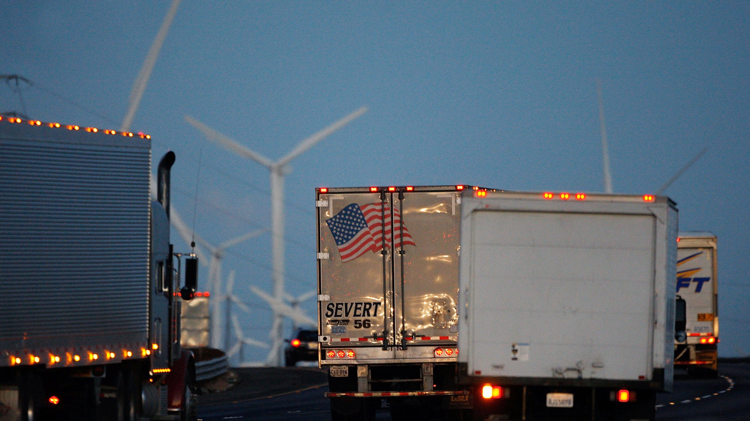 Trucks pass windmills on the 10 Freeway on Dec. 8, 2009 near Banning. (David McNew/Getty Images)