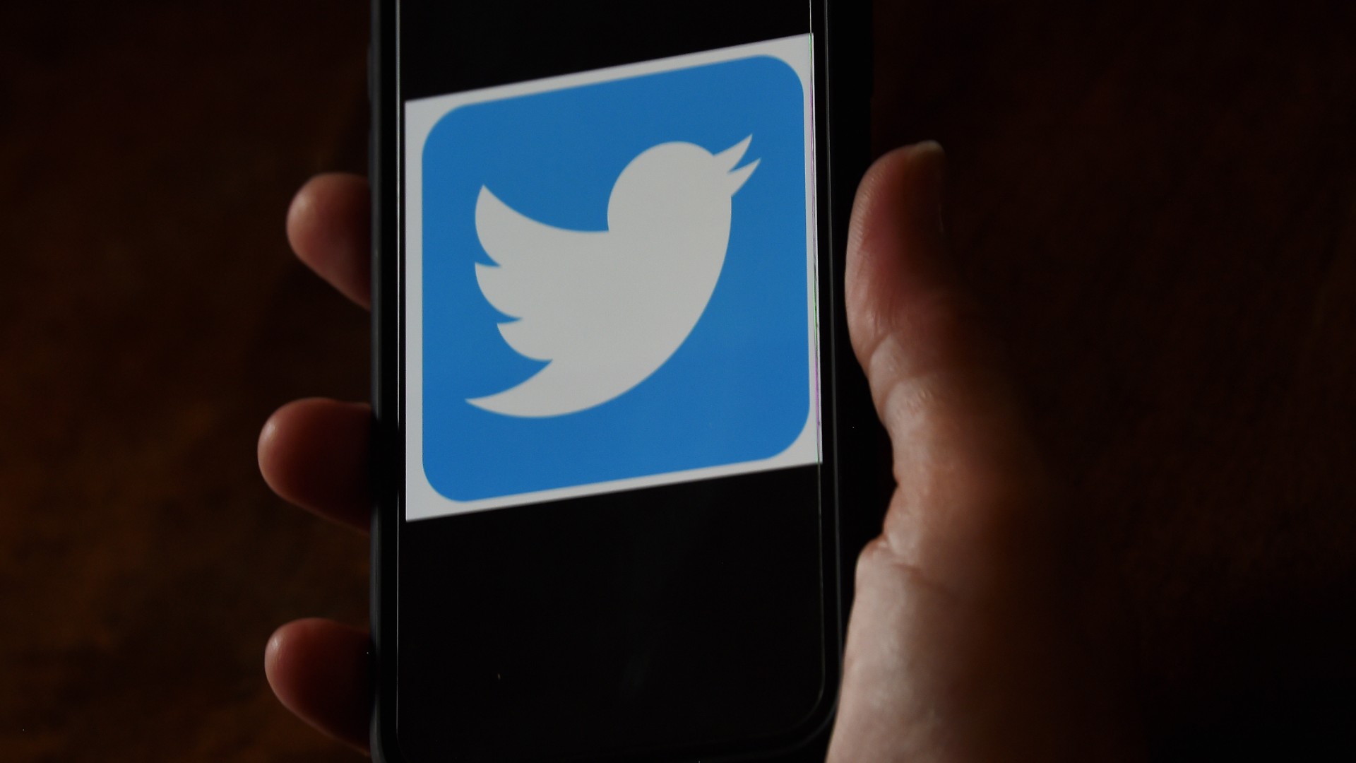 In this photo illustration, a Twitter logo is displayed on a mobile phone on May 27, 2020, in Arlington, Virginia. (OLIVIER DOULIERY/AFP via Getty Images)