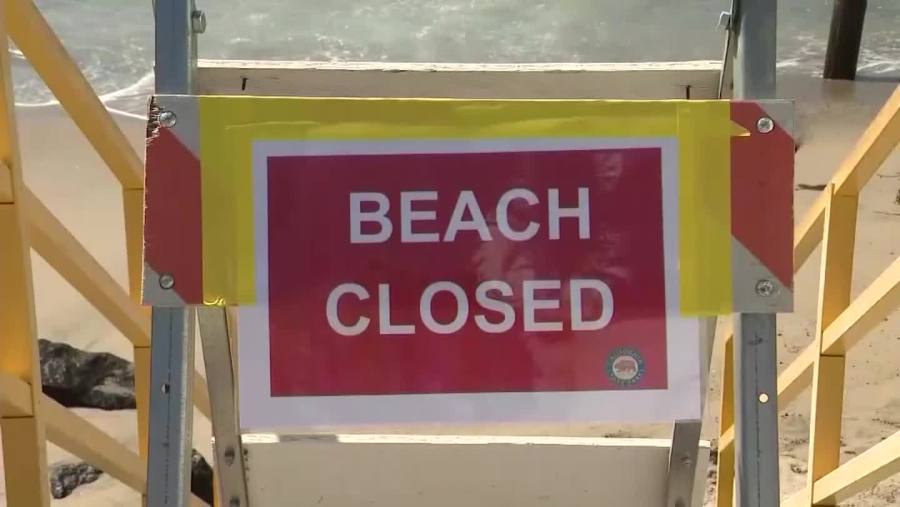 A beach closed sign is seen in an undated file photo.