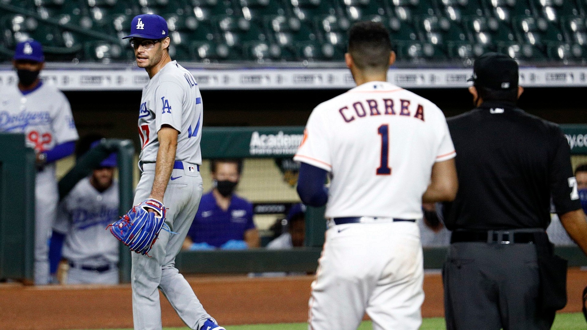 Joe Kelly of the Los Angeles Dodgers has a word with Carlos Correa of the Houston Astros as he walks off the mound after a series of high inside pitches in the sixth inning at Minute Maid Park on July 28, 2020 in Houston, Texas. Both benches emptied. (Bob Levey/Getty Images)