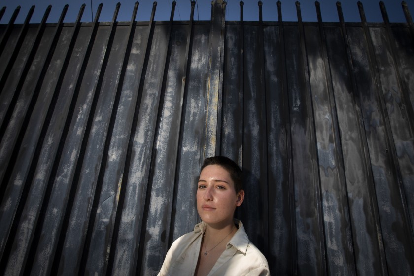 Julia Dupuis, 21, photographed Sunday, says an LAPD officer groped her June 2 as she was being arrested on a curfew violation while participating in a demonstration. (Francine Orr / Los Angeles Times)