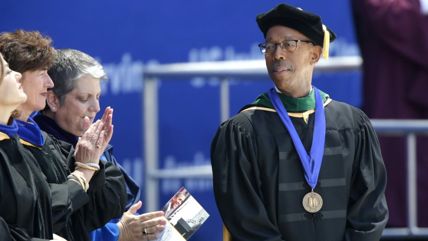 Then-UC Irvine Chancellor Michael V. Drake, right, stands beside UC President Janet Napolitano at UCI’s class of 2014 commencement ceremony held at Angel Stadium of Anaheim. (Irfan Khan / Los Angeles Times)