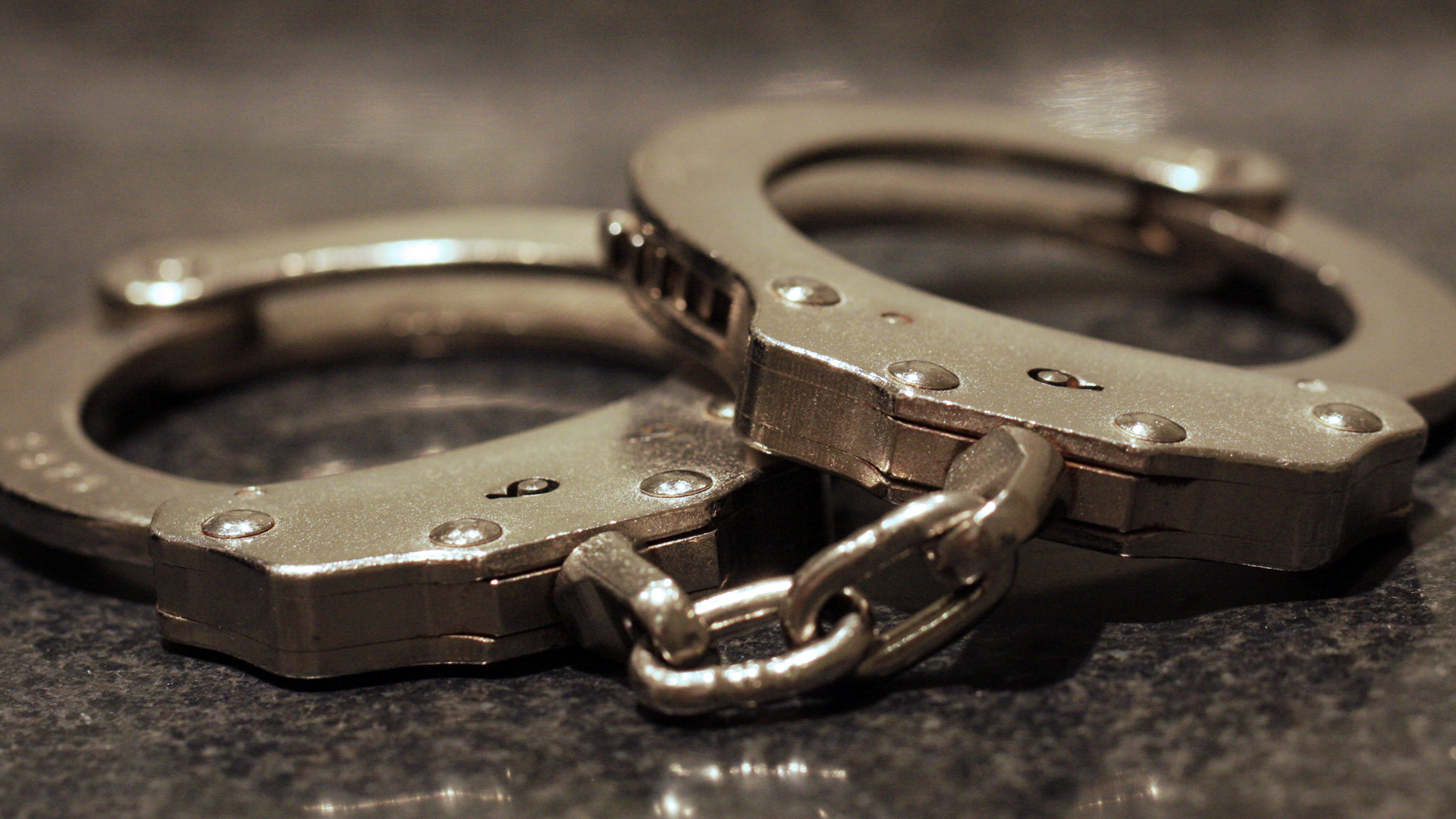 Handcuffs sit on a table in this file photo. (Credit: Getty Images)