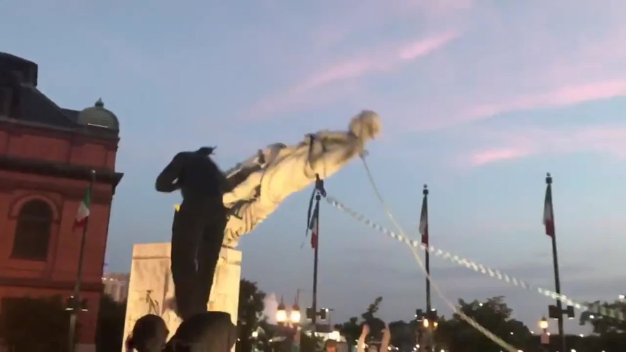 Protesters in Baltimore toppled a statue of Christopher Columbus and threw it into the Inner Harbor on July 4, 2020. (Louis Krauss)