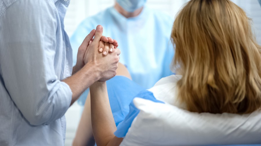 A woman giving birth. (Shutterstock)