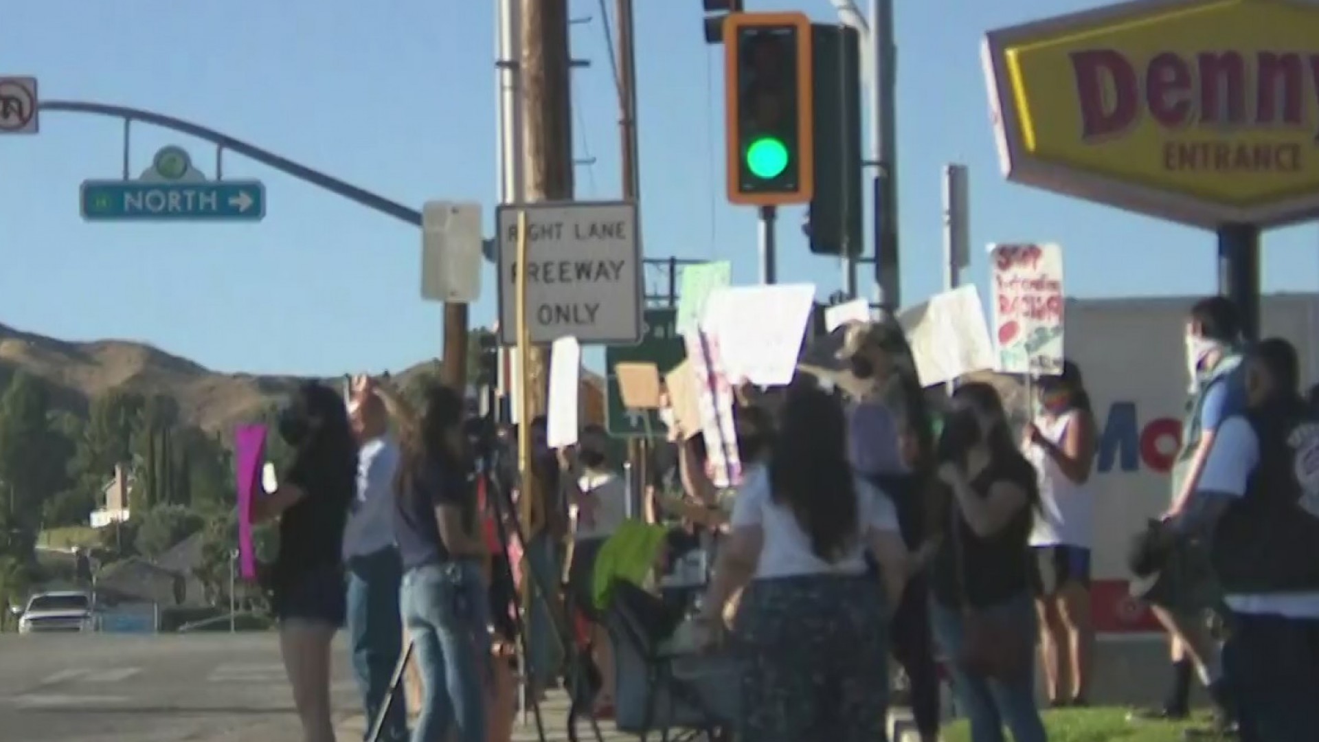 On July 18, 2020, protesters rally behind a pair of street vendors harassed by a local bar owner in a confrontation captured on camera days earlier in Canyon Country. (KTLA)