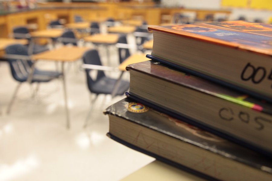 A file photo shows textbooks and empty student desks inside an Atlanta, Georgia school.