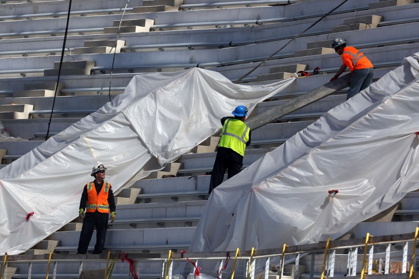 A construction team works at SoFi Stadium in this undated photo. (Dania Maxwell / Los Angeles Times)