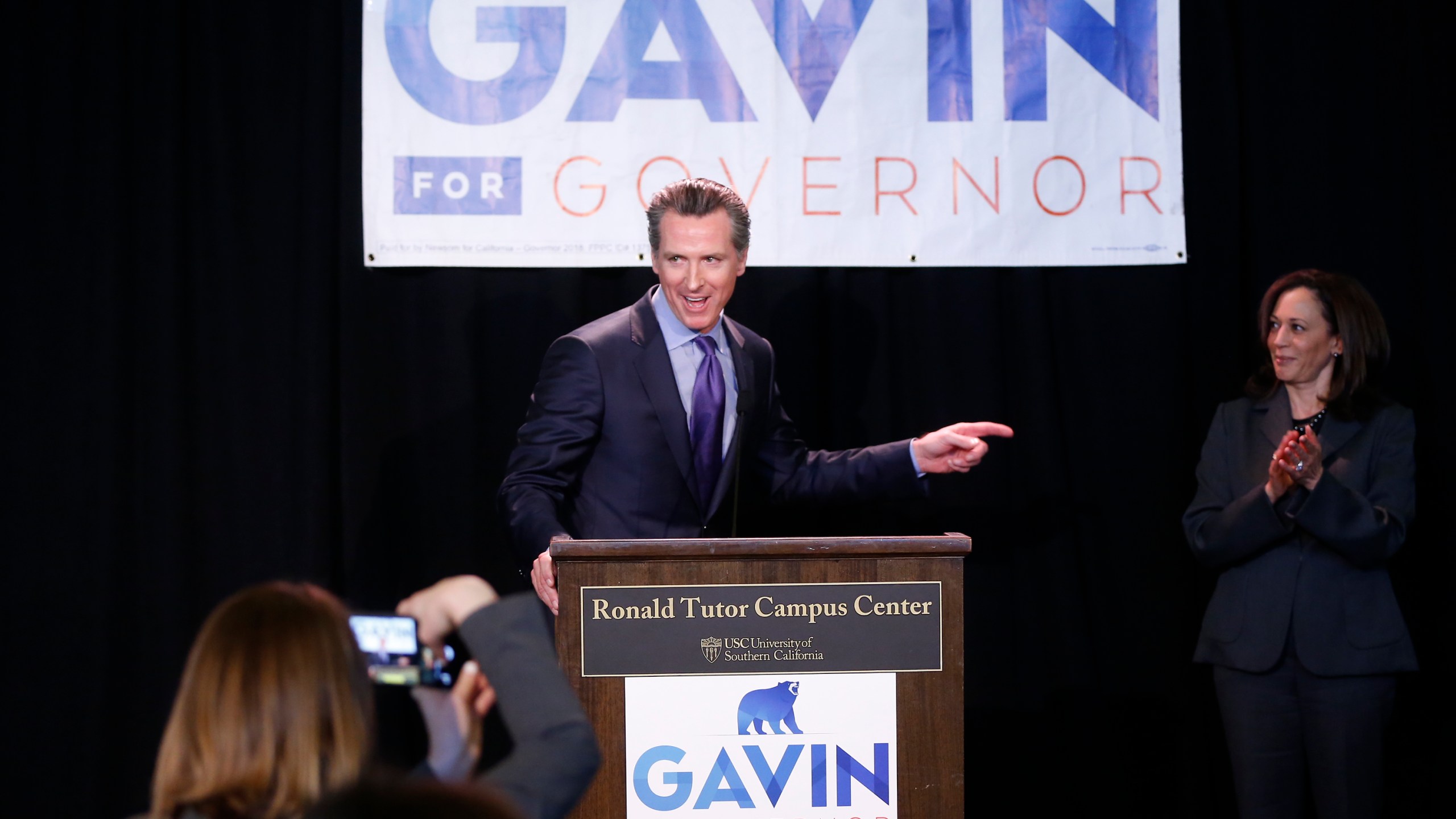 Sen. Kamala Harris, right, endorses California Lt. Gov. Gavin Newsom, left, for the 2018 California Governor's race at the Ronald Tutor Campus Center at the University of Southern California on Feb. 16, 2018. (Damian Dovarganes/Associated Press)