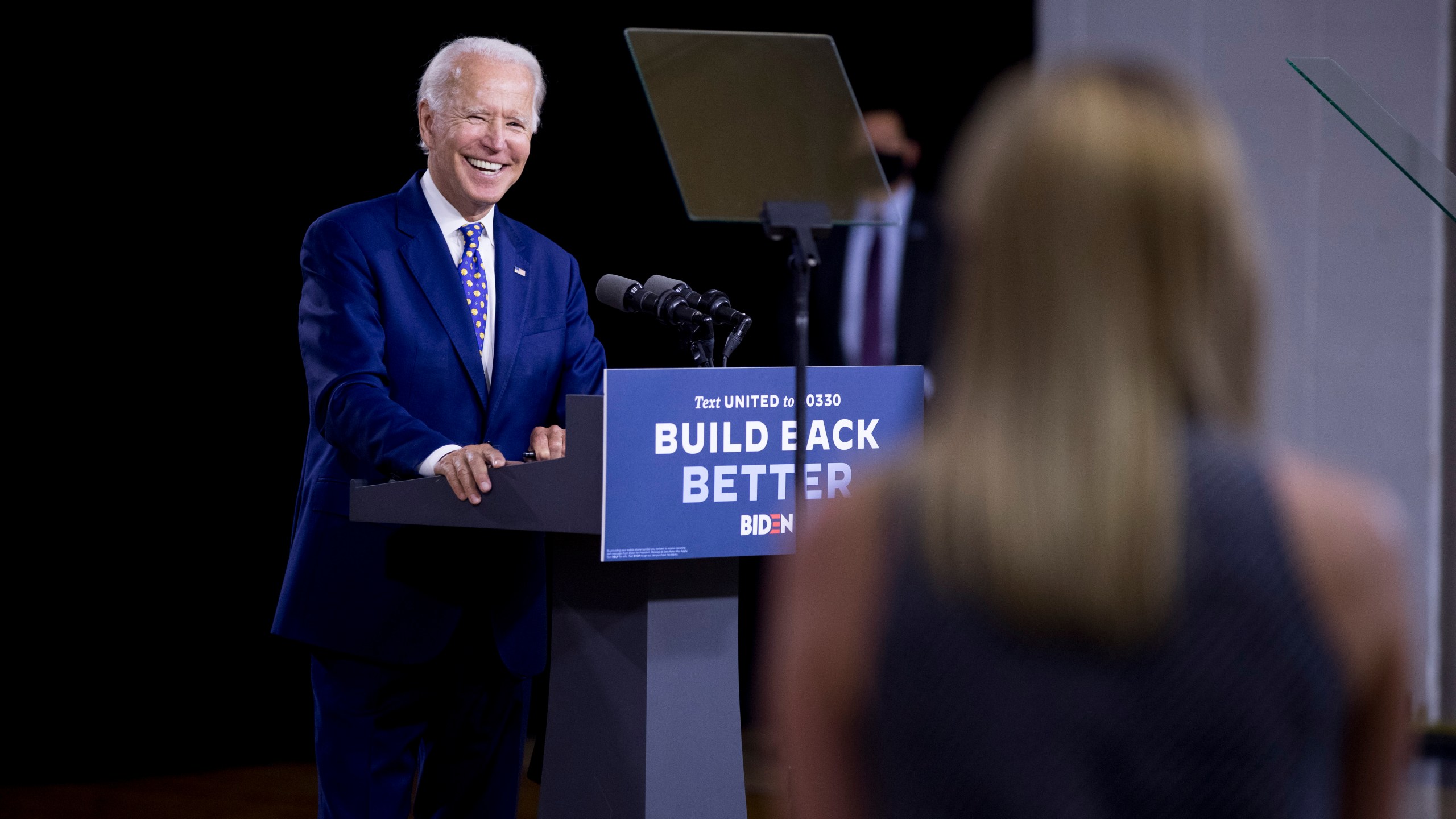 Democratic presidential candidate former Vice President Joe Biden smiles as he takes a question from a reporter at a campaign event at the William "Hicks" Anderson Community Center in Wilmington, Del., Tuesday, July 28, 2020. (AP Photo/Andrew Harnik)