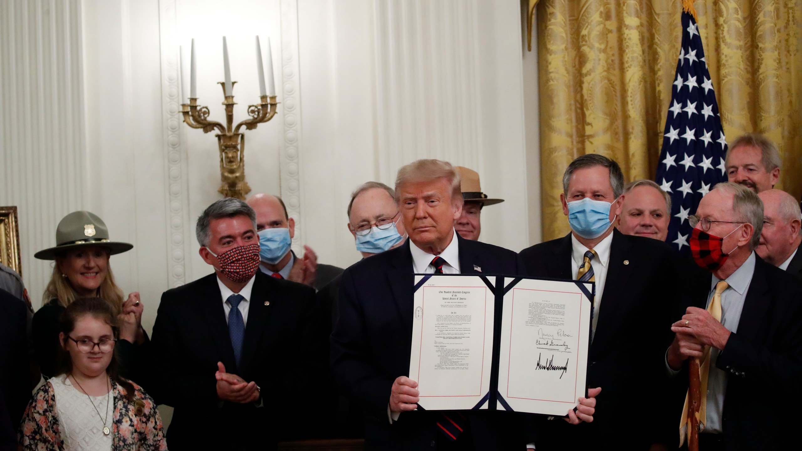 Donald Trump poses for a photo during a signing ceremony for H.R. 1957 – "The Great American Outdoors Act," in the East Room of the White House on Aug. 4, 2020. (Alex Brandon)