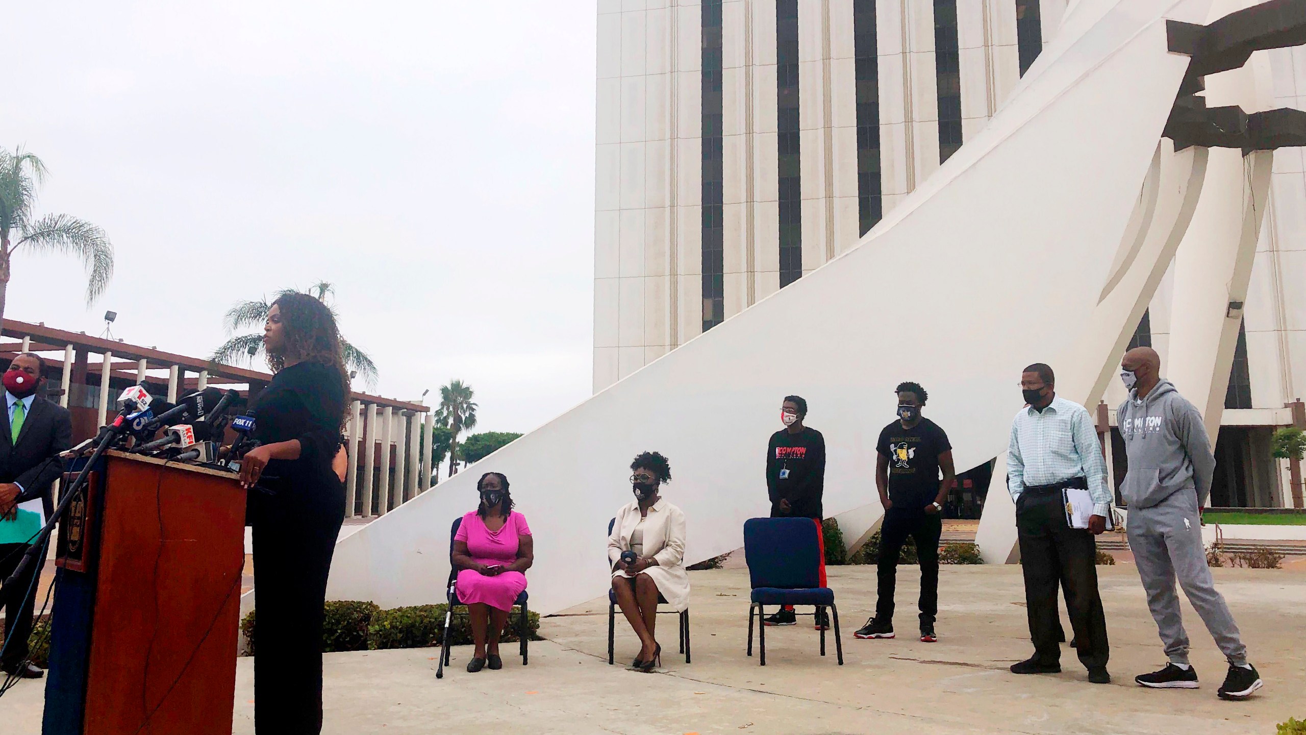 Compton Mayor Aja Brown, left, calls on the state attorney general's office and the U.S. Department of Justice to investigate the Los Angeles County Sheriff's station at a news conference in Compton on Aug. 4, 2020. (AP Photo/Stefanie Dazio)