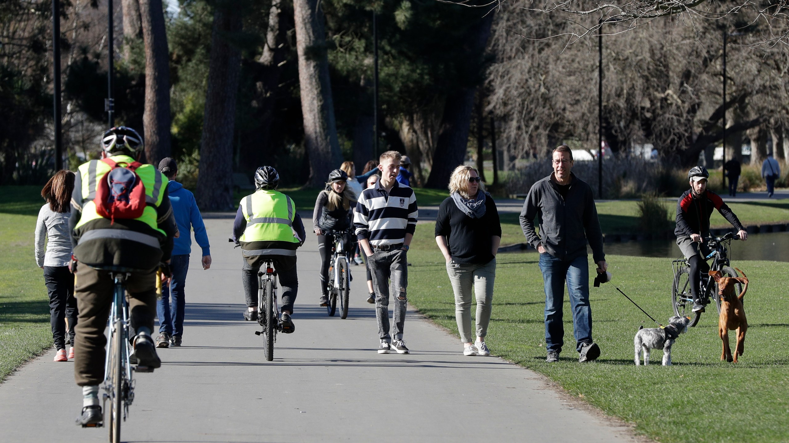 Residents exercise at Hagley Park in Christchurch, New Zealand, Sunday, Aug. 9, 2020. (AP Photo/Mark Baker)