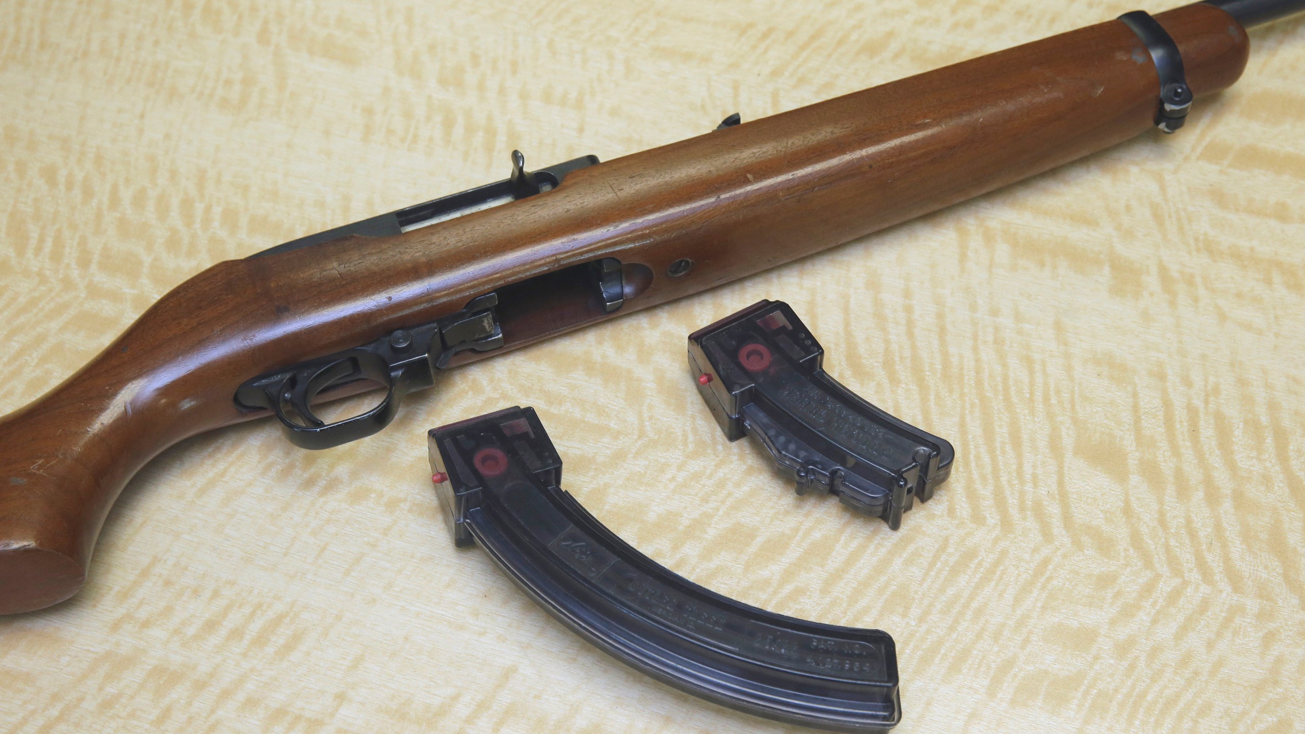 In this Tuesday, June 27, 2017, file photo, a semi-automatic hand gun is displayed with a 10 shot magazine, left, and a 15 shot magazine, right, at a gun store in Elk Grove, Calif. A three-judge panel of the 9th U.S. Circuit Court of Appeals has thrown out California's ban on high-capacity ammunition magazines. The panel's majority ruled Friday, Aug. 14, 2020, that the law banning magazines holding more than 10 bullets violates the constitutional right to bear firearms. (AP Photo/Rich Pedroncelli, File)