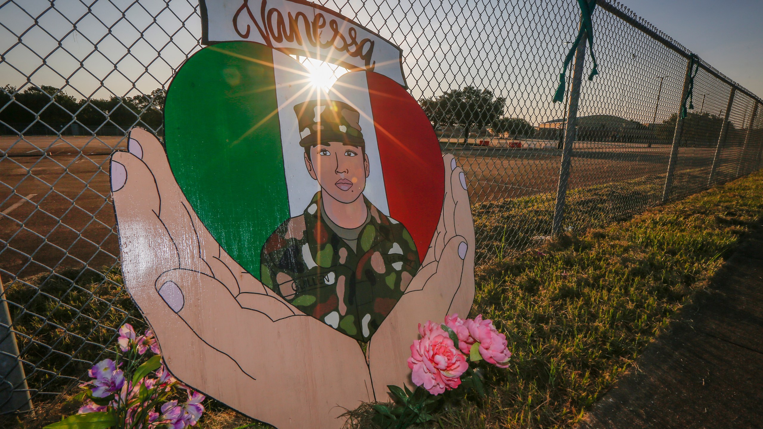 A small memorial for U.S. Army Specialist Vanessa Guillen is set up around Cesar Chavez High School Friday, Aug. 14, 2020, in Houston. Investigators said Guillen was bludgeoned to death on base by a fellow soldier, who later killed himself. (Steve Gonzales/Houston Chronicle via AP)