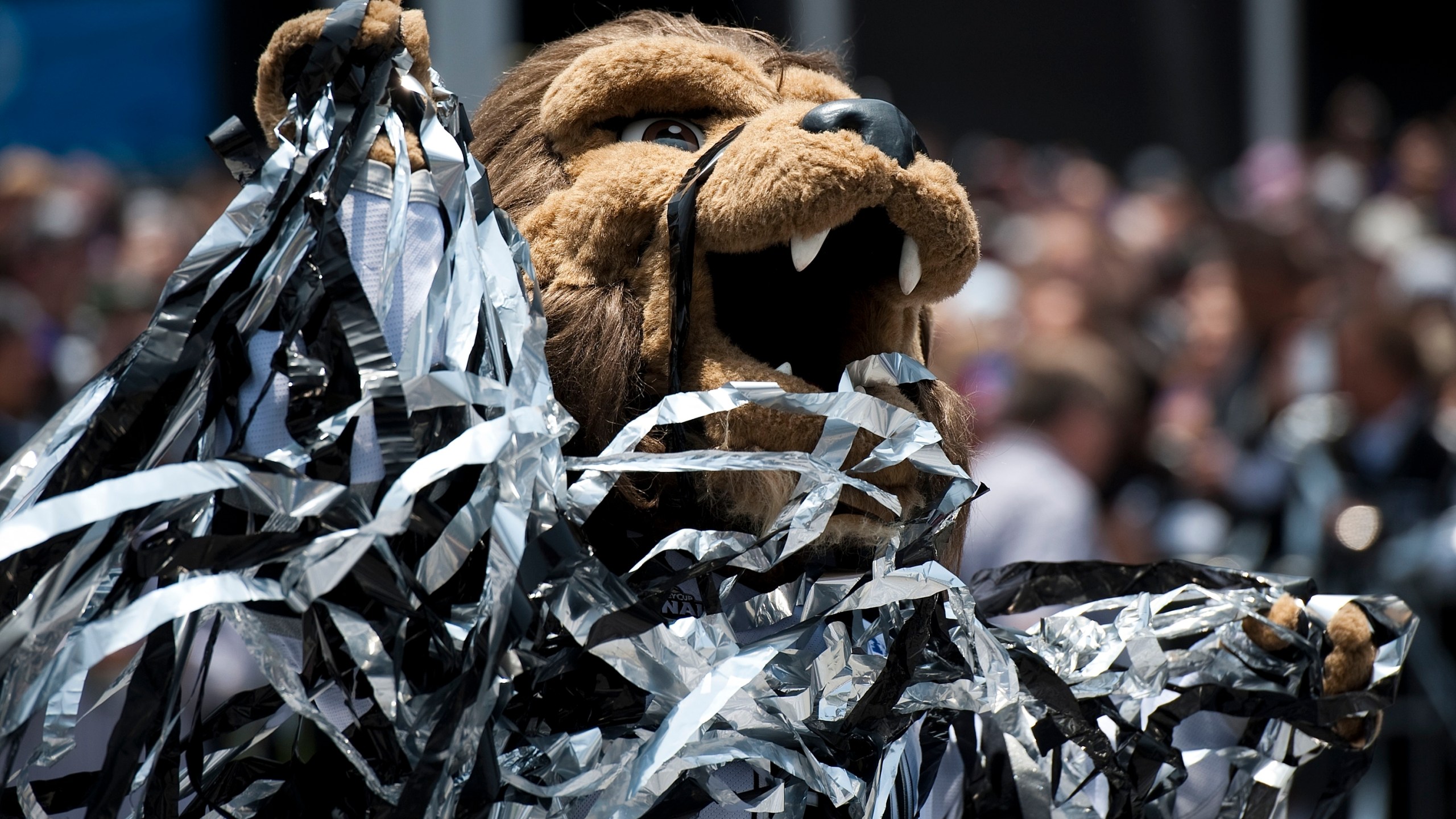 This June 14, 2012 file photo shows Bailey, the Los Angeles Kings' mascot covered in confetti at the end of a parade celebrating the teams' winning of the Stanley Cup in the NHL hockey championship at Staples Center, Los Angeles. (AP Photo/Grant Hindsley, File)