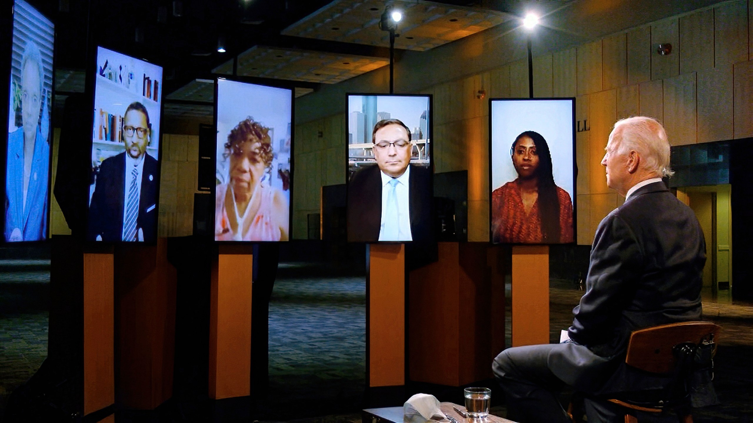 In this image from video, Democratic presidential candidate former Vice President Joe Biden leads a conversation on racial justice with Art Acevedo, Jamira Burley, Gwen Carr, Derrick Johnson and Lori Lightfoot during the first night of the Democratic National Convention on Aug. 17, 2020. (Democratic National Convention via Associated Press)