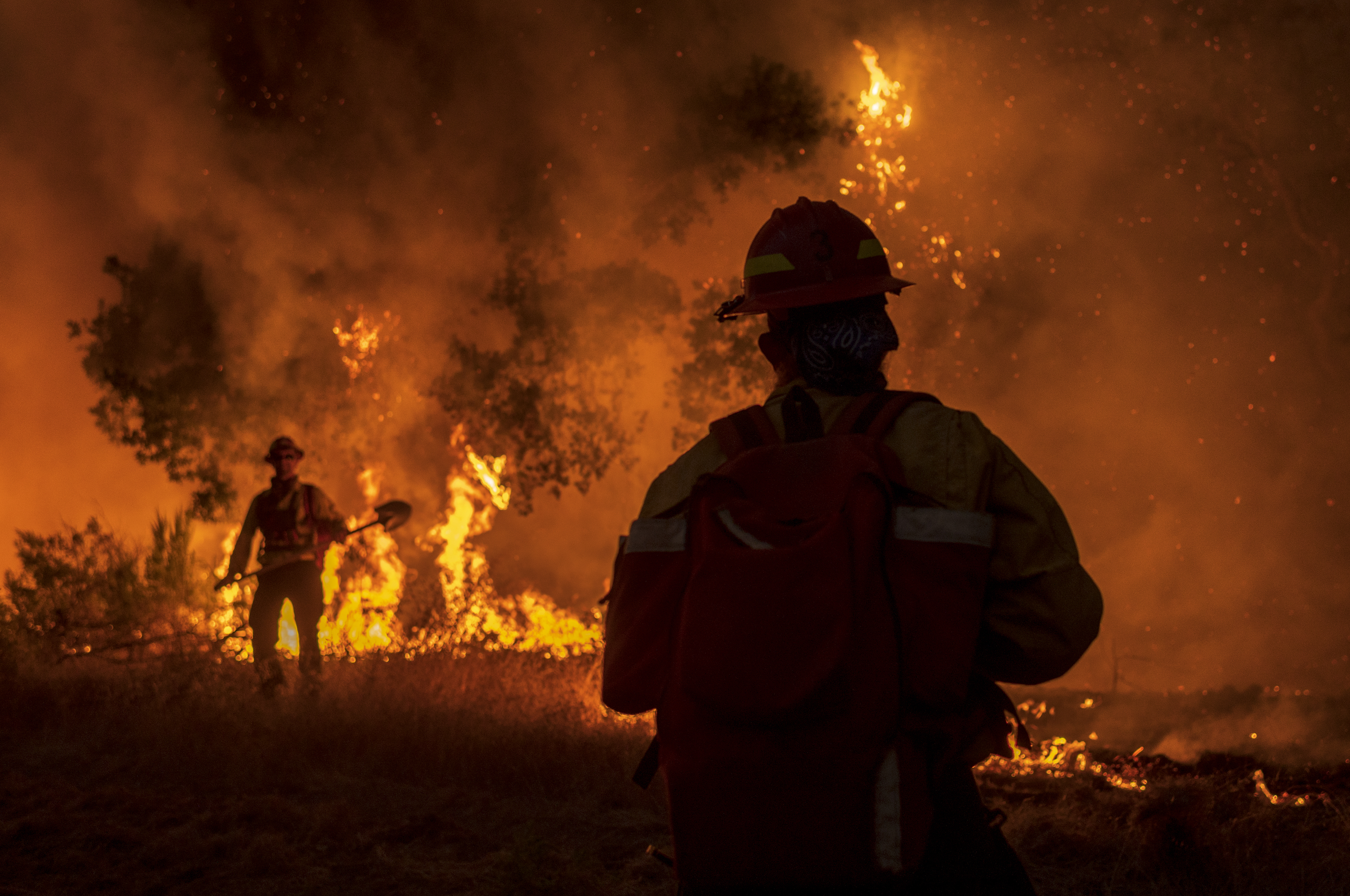 Members of the Grizzly Firefighters fight the Carmel Fire near Carmel Valley, Calif., Tuesday, Aug. 18, 2020. (AP Photo/Nic Coury)