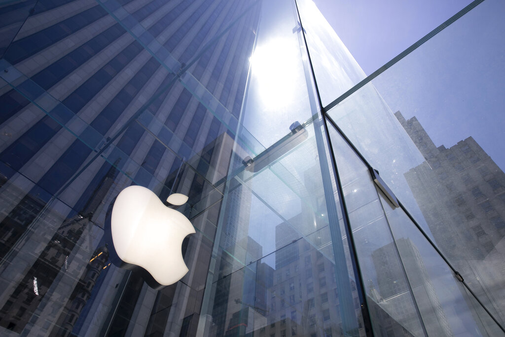 In this June 16, 2020 file photo, the sun is reflected on Apple's Fifth Avenue store in New York. (AP Photo/Mark Lennihan, File)