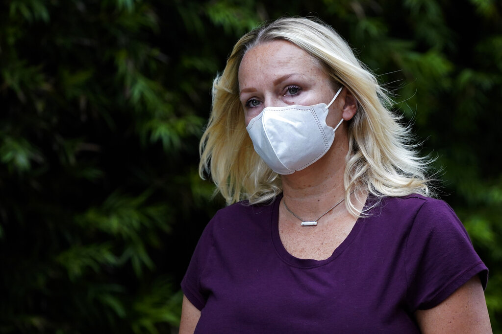 Margaret Hunter, the wife of former California Republican Rep. Duncan Hunter, leaves a federal building on Aug. 24, 2020, in San Diego. (AP Photo/Gregory Bull)