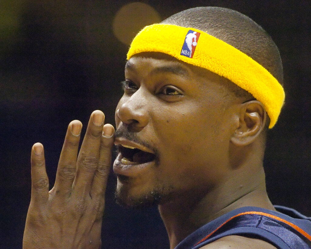 In this Nov. 15, 2004 file photo, Golden State Warriors' Clifford Robinson talks with fans during a foul shot in the fourth quarter against the Cleveland Cavaliers in Cleveland. (AP Photo/Mark Duncan, File)