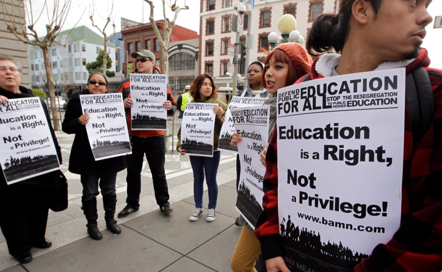 In this Feb. 13, 2012, file photo, demonstrators protest outside the U.S. 9th Circuit Court of Appeals after a panel heard oral arguments in San Francisco in a lawsuit seeking to overturn Proposition 209, which barred racial, ethnic or gender preferences in public education, employment and contracting. (AP Photo/Paul Sakuma, File)