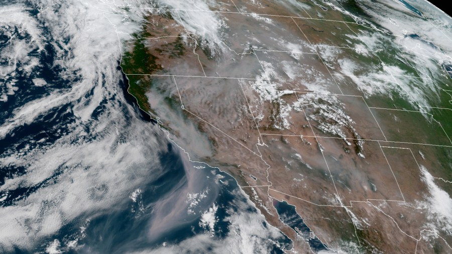 Smoke from the wildfires in California is seen stretching some 600 miles off the coast of California and over several states in a NOAA satellite image dated August 20. (GOES-17/NOAA)