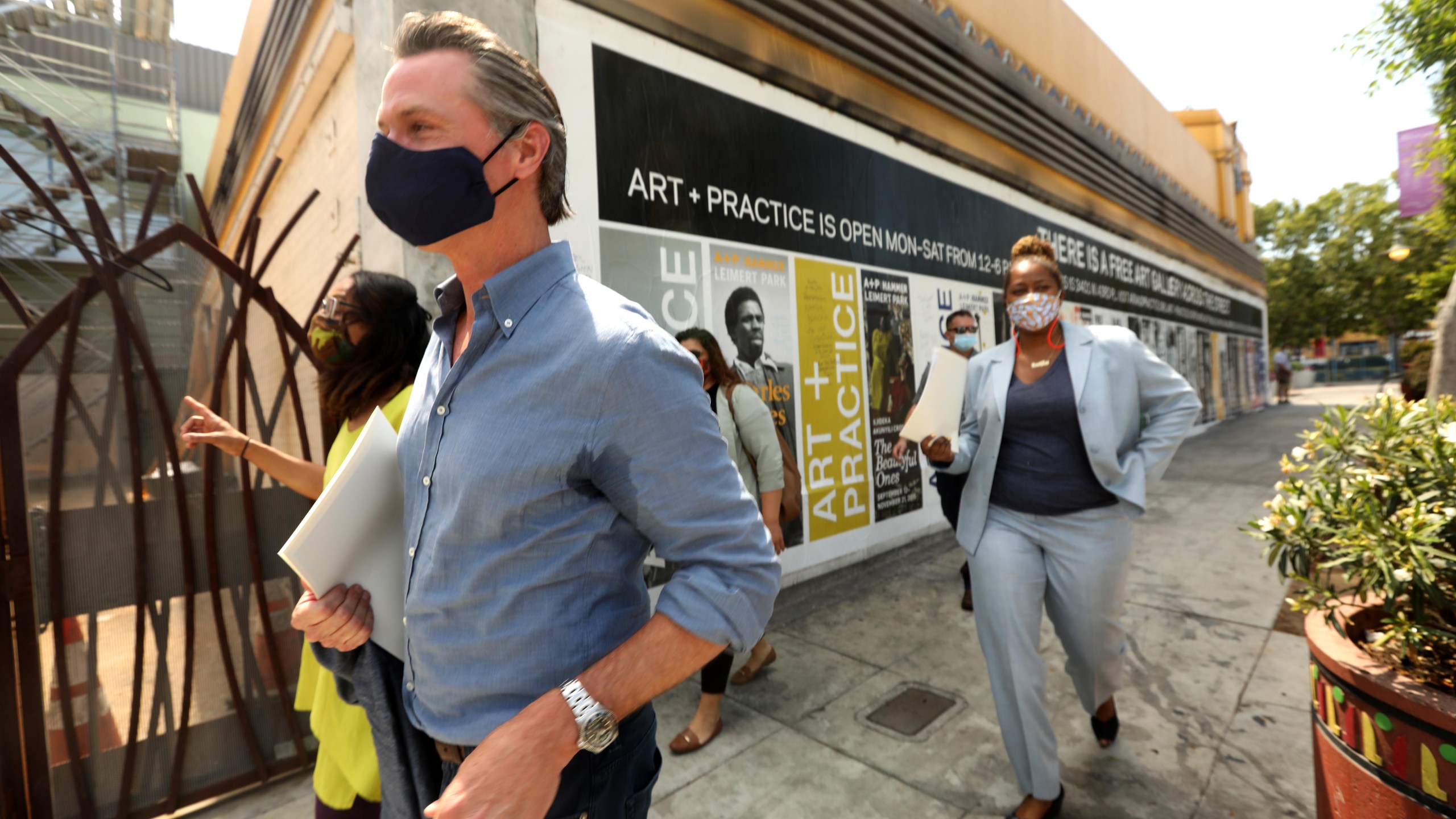 California Gov. Gavin Newsom takes a tour of businesses in Leimert Park with California Assembly Member Sydney Kamlager-Dove (L) and California Senator Holly Mitchell (R) after days of protests in Los Angeles in Leimert Park in Los Angeles on June 3, 2020, as the state opens from the coronavirus shutdown. (Genaro Molina / POOL / AFP via Getty Images)