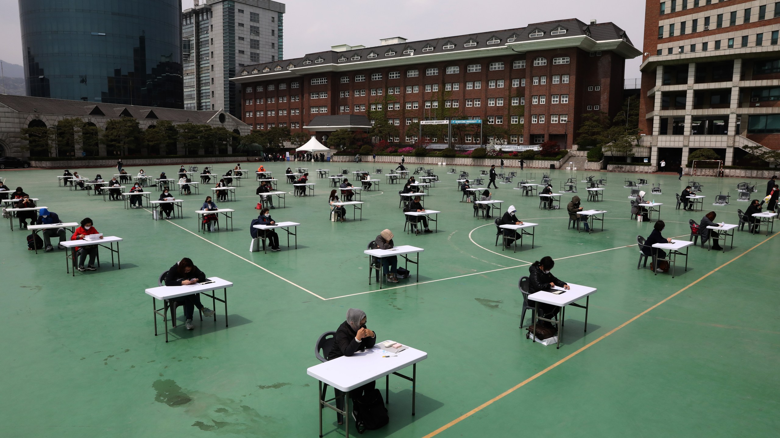 Students take an exam outdoors at Seokyeong University on April 25, 2020 in Seoul, South Korea. (Chung Sung-Jun/Getty Images)