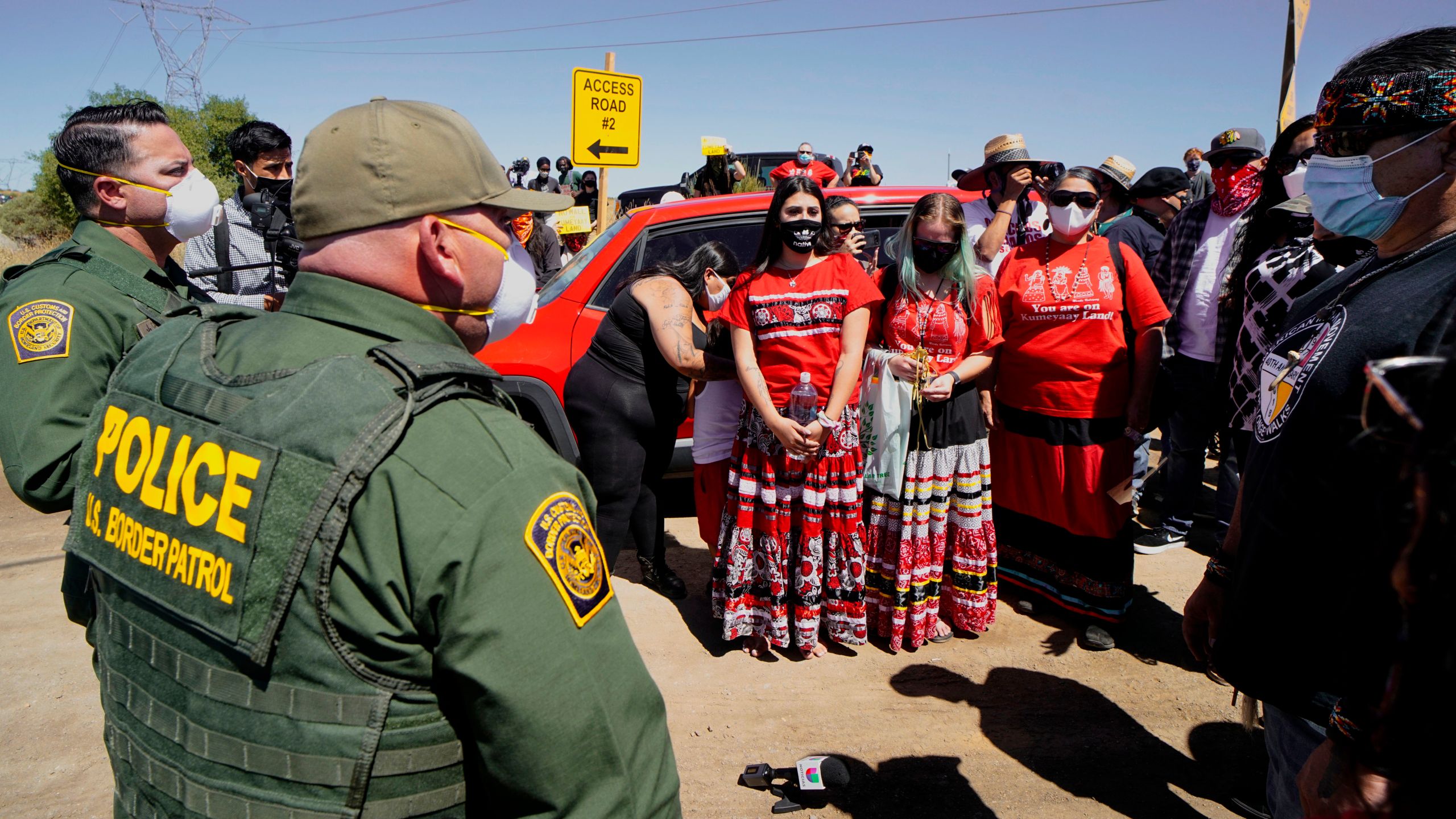 Members of the Kumeyaay band of Indians and demonstrators prepare to march to the U.S.-Mexico border to protest construction of a new wall being constructed on their ancestral grounds on July 1, 2020 in Boulevard, California. (SANDY HUFFAKER/AFP via Getty Images)