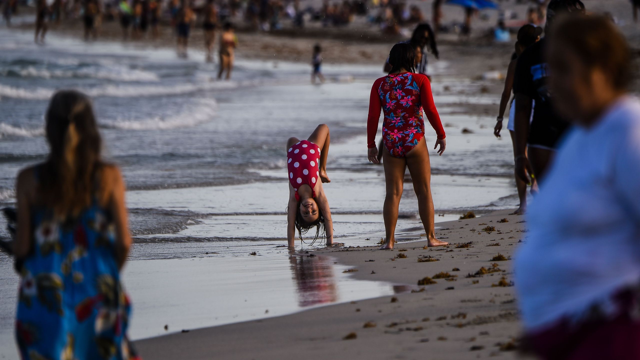 Children play on the beach in Miami Beach, Florida on July 28, 2020, amid the coronavirus pandemic. (CHANDAN KHANNA/AFP via Getty Images)