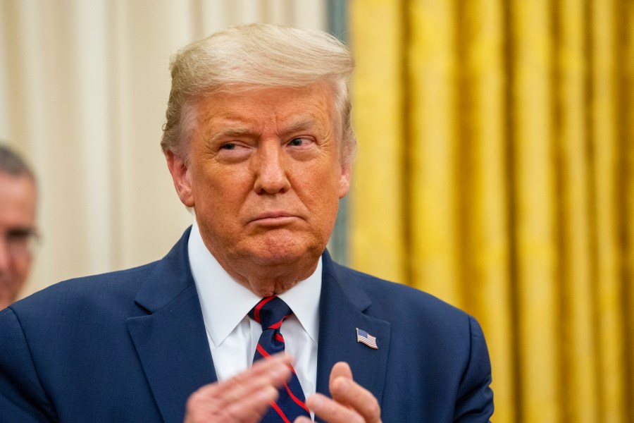 Donald Trump participates in the swearing in of General Charles Q. Brown as the incoming Chief of Staff of the Air Force, in the Oval Office of the White House on Aug. 4, 2020. (Doug Mills-Pool/Getty Images)