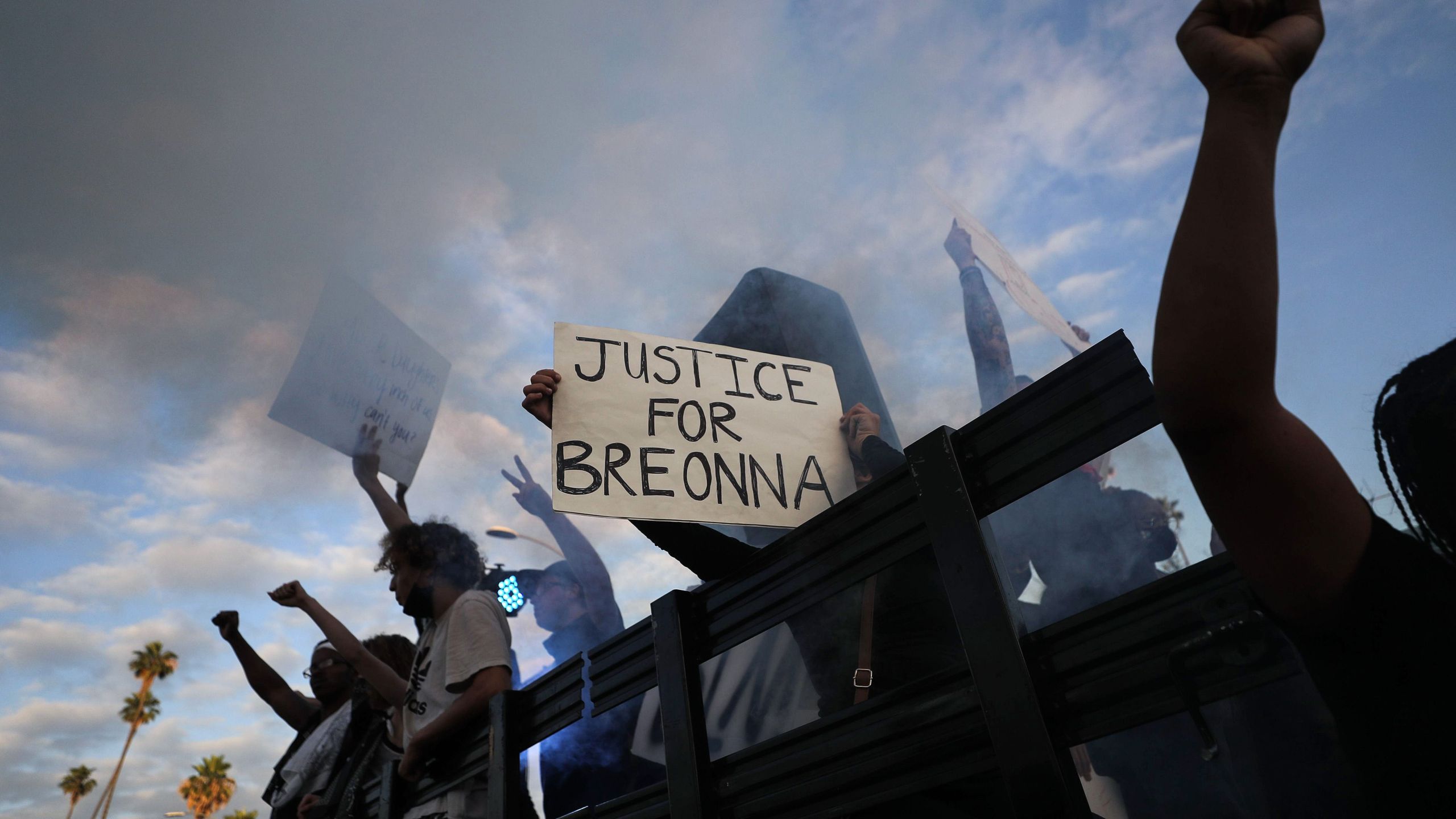 Protesters ride aboard a vehicle with a smoke machine, with a sign reading "Justice for Breonna," during a demonstration against racism and police brutality on Hollywood Boulevard on June 6, 2020. (Mario Tama/Getty Images)