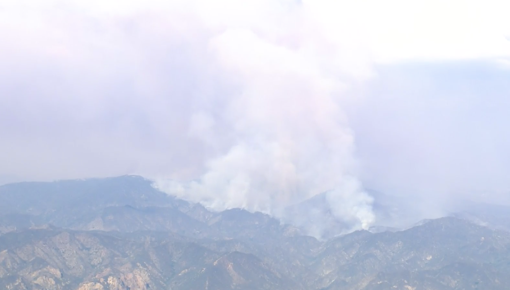 Plumes of smoke emerge from the Lake Fire as it burns through the Lake Hughes area of Los Angeles County on Aug. 15, 2020. By that time, the wildfire had scorched more than 23 square miles. (KTLA)