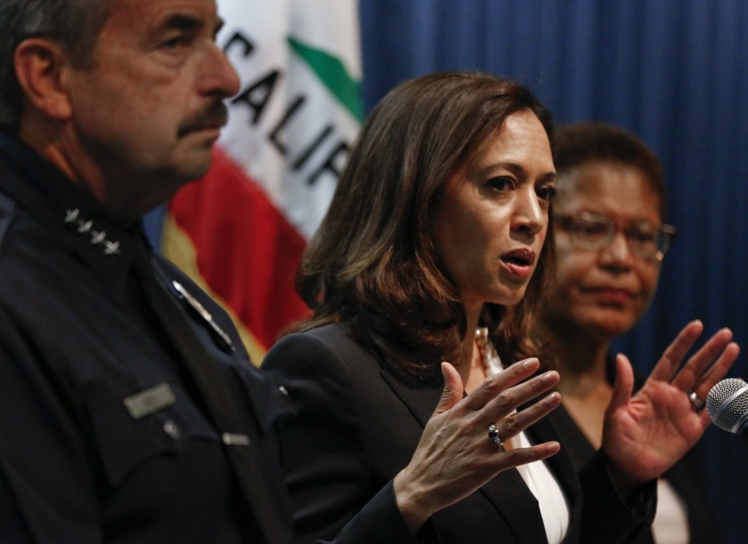 Kamala Harris, then California attorney general, appears alongside Rep. Karen Bass, right, at a news conference in this undated file photo. (Los Angeles Times)