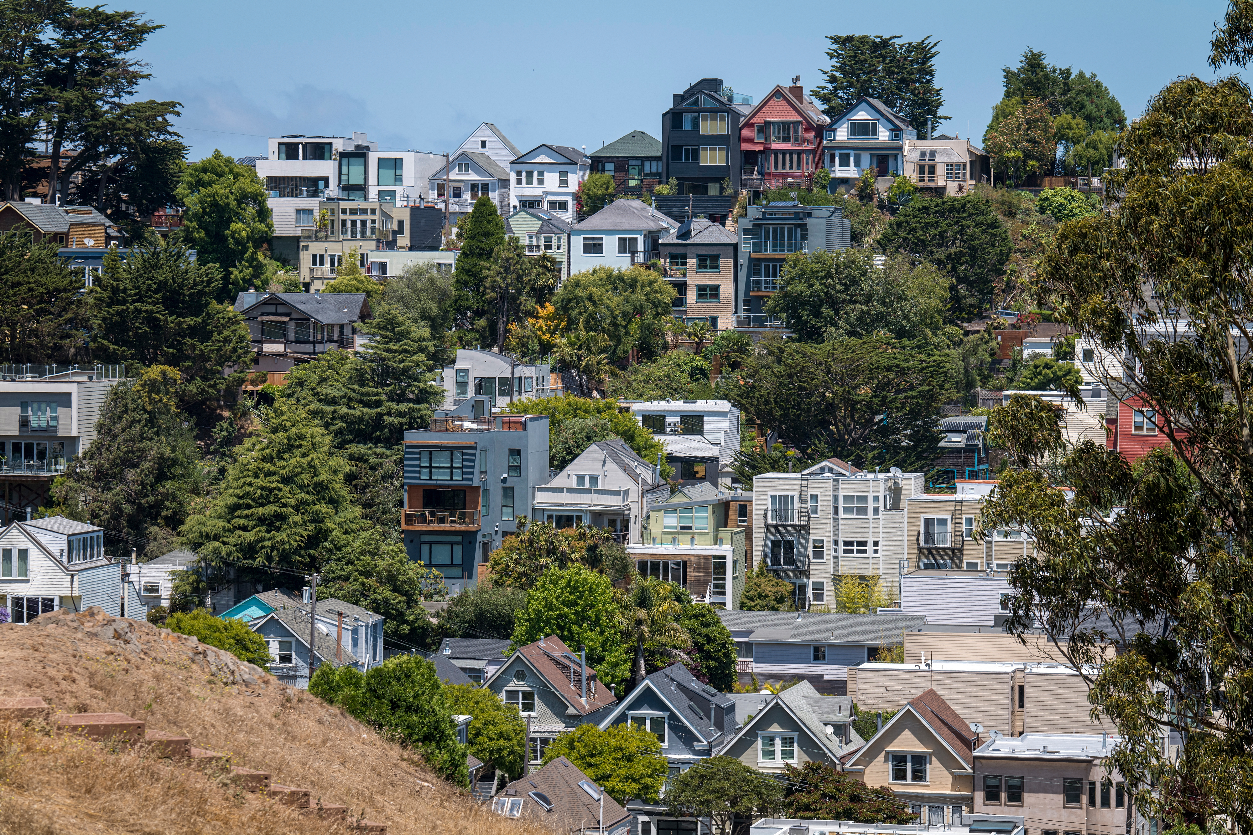 Homes stand in San Francisco, California, U.S., on, July 2, 2020. Rents for San Francisco and Silicon Valley hubs such as Mountain View and Palo Alto have seen rents plunge -- a sign residents of the tech-heavy region are taking advantage of remote work arrangements to flee to cheaper areas. (David Paul Morris/Bloomberg via Getty Images)