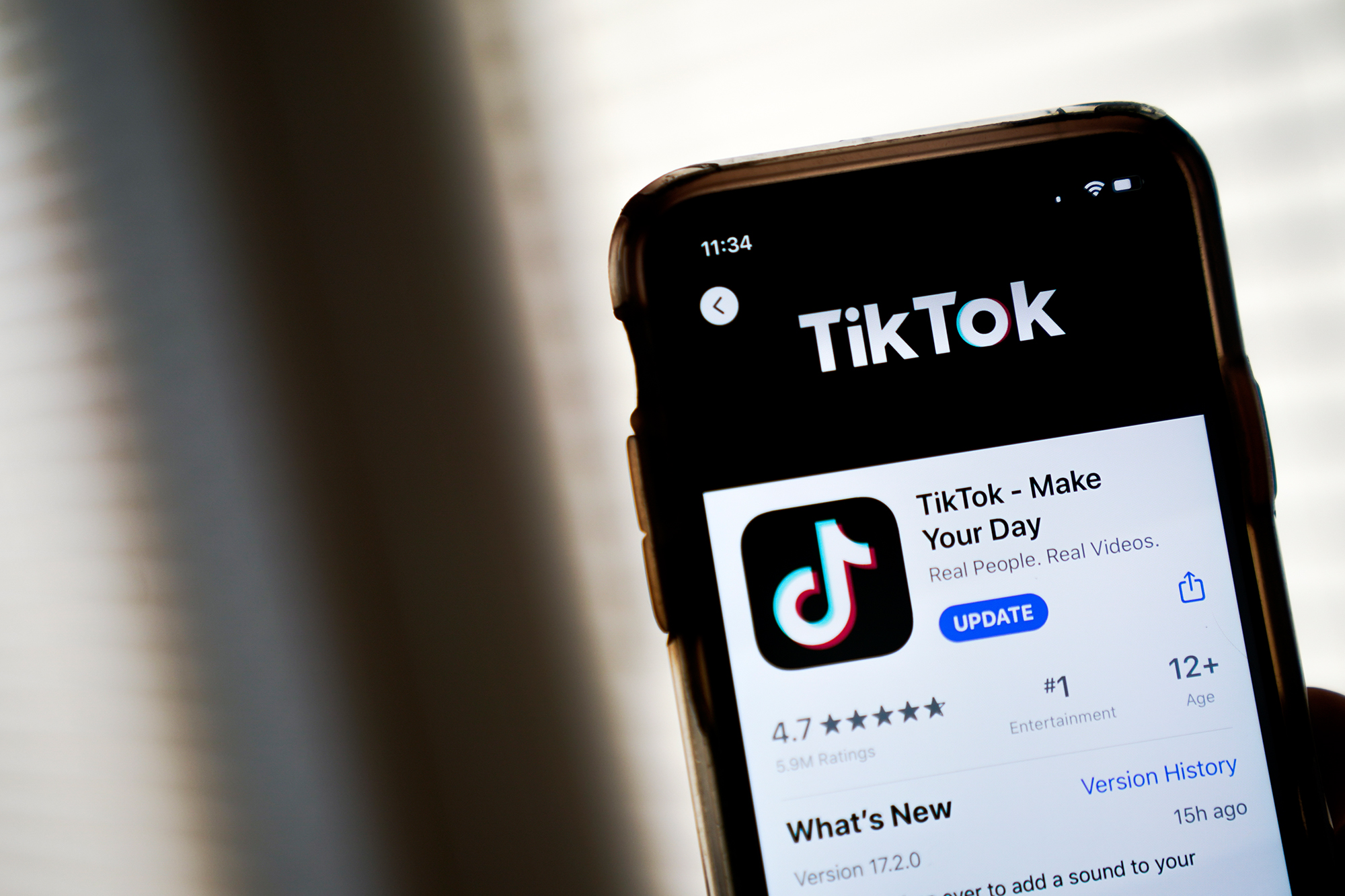 In this photo illustration, the download page for the TikTok app is displayed on an Apple iPhone on August 7, 2020 in Washington, DC. (Drew Angerer/Getty Images)