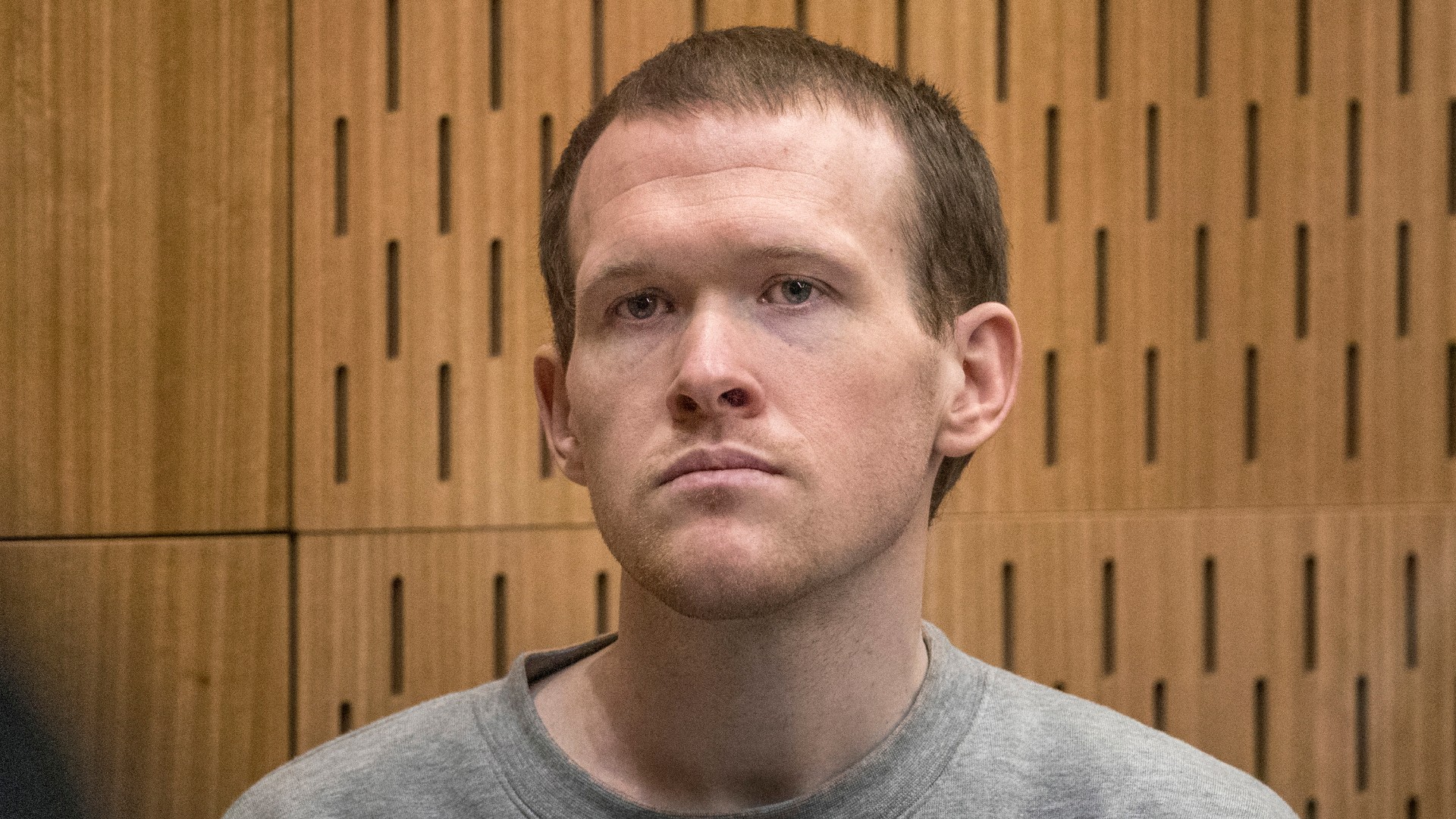 Australian Brenton Harrison Tarrant, 29, sits in the dock on the final day of his sentencing hearing at the Christchurch High Court after pleading guilty to 51 counts of murder, 40 counts of attempted murder and one count of terrorism in Christchurch, New Zealand, Thursday, Aug. 27, 2020. (John Kirk-Anderson/Pool Photo via AP)