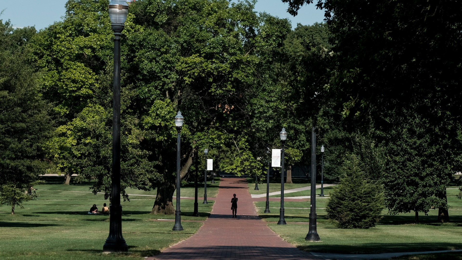 A lone person makes their way through the 'Oval' at Ohio State University, a part of campus which, during the school year, is popular with students and faculty of the university, on August 13, 2020 in Columbus, Ohio. (Matthew Hatcher/Getty Images)