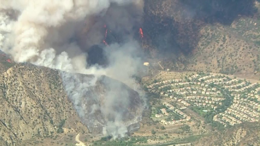 Flames and heavy smoke surround the Mountain Cove community in Azusa during the Ranch Fire on Aug. 13, 2020. (KTLA)