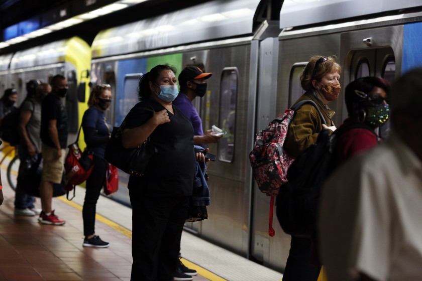 Transit riders wait for the A Line at the 7th Street/Metro Center station in downtown Los Angeles in July 2020. (Dania Maxwell / Los Angeles Times)