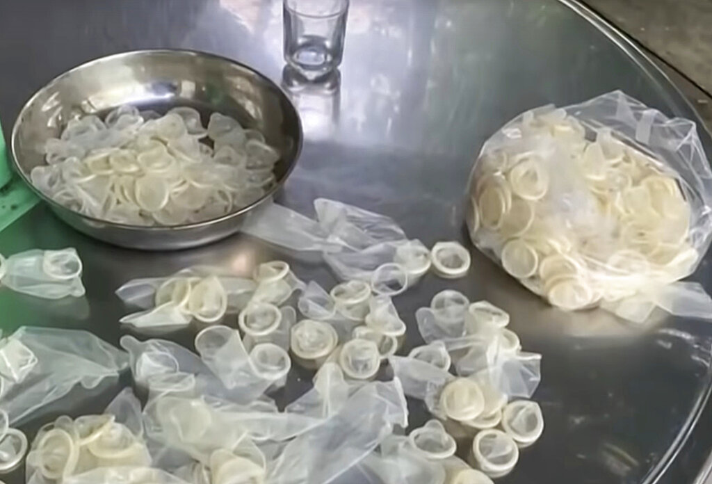 According to a market inspector, the owner of the factory, a 34-year-old woman, confessed that they bought used condoms from a man in the province. The condoms would then be washed, reshaped and packed into plastic packages, the newspaper said.