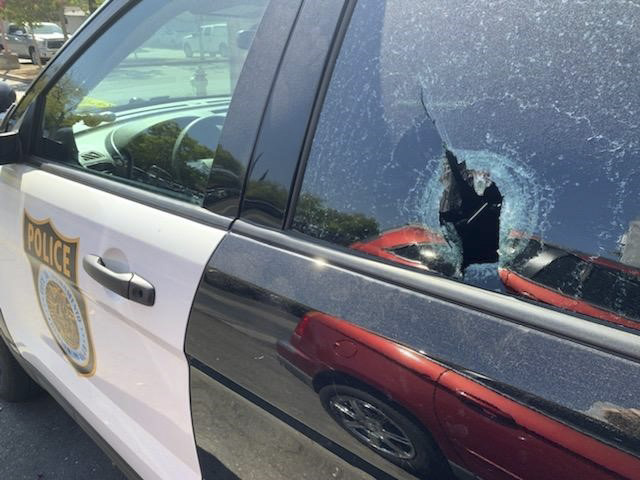 In a photo provided by the Sacramento Police Department, a patrol car shows damage from gunfire to one of its windows after a suspect, who had threatened suicide, fired on the vehicle Tuesday, Aug. 4, 2020, in Sacramento. Calif. Police said officers went to a home Tuesday night after 50-year-old Albert Wheeler's family reported that he had a gun and was threatening to commit suicide. (Sacramento Police Department via AP)