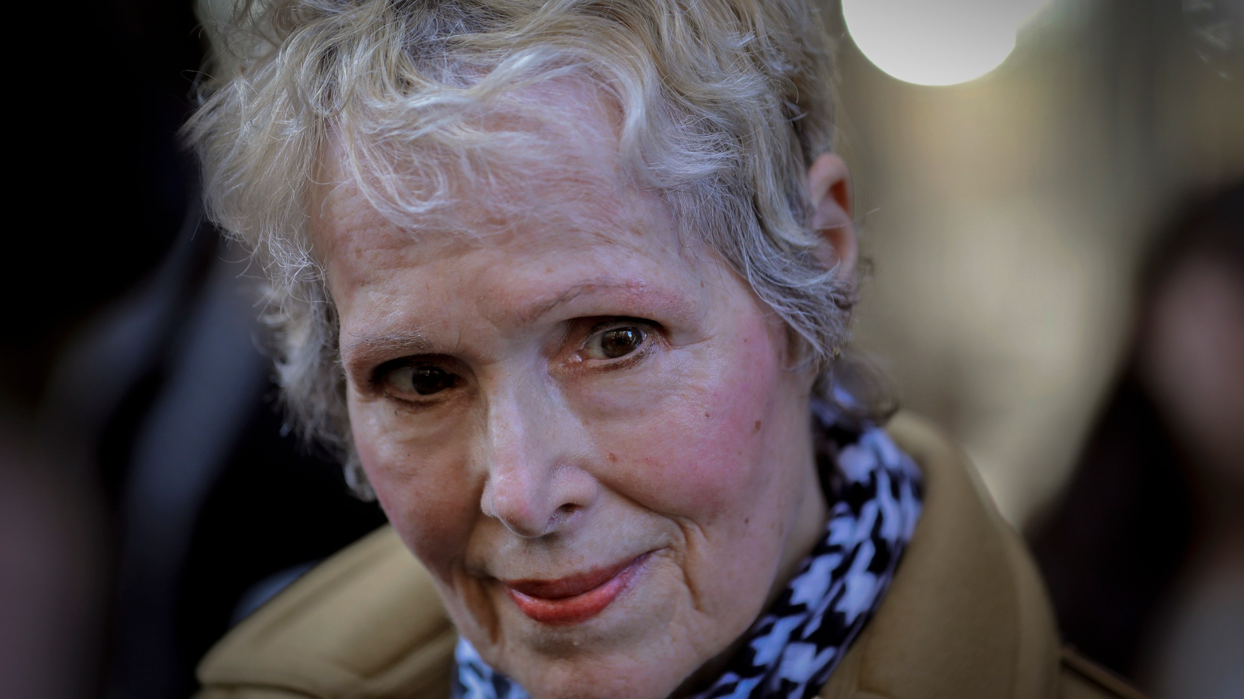 In this photo from March 4, 2020, E. Jean Carroll talks to reporters outside a courthouse in New York. (AP Photo/Seth Wenig, File)