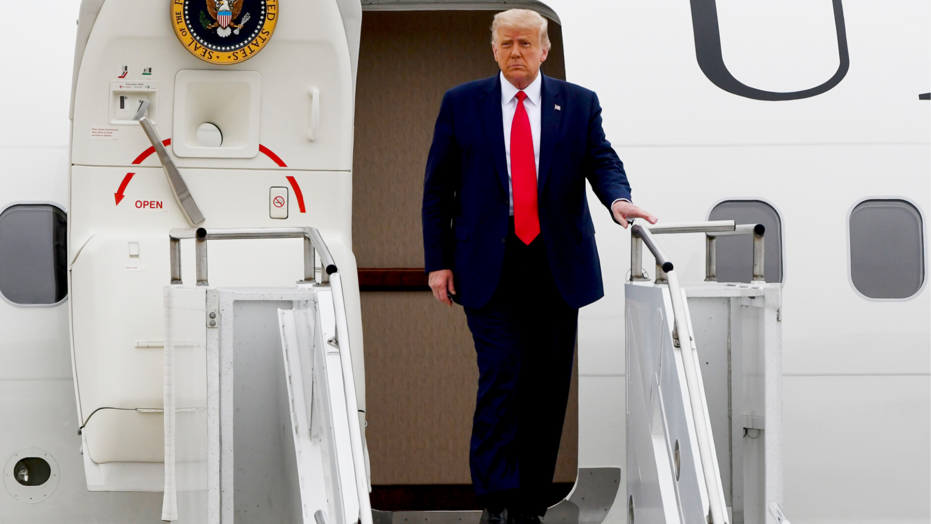 President Donald Trump walks from Air Force One as he arrives at Waukegan National Airport before attending a series of events in Kenosha, WI on Sept. 1, 2020, in Waukegan, IL. (AP Photo/Matt Marton)