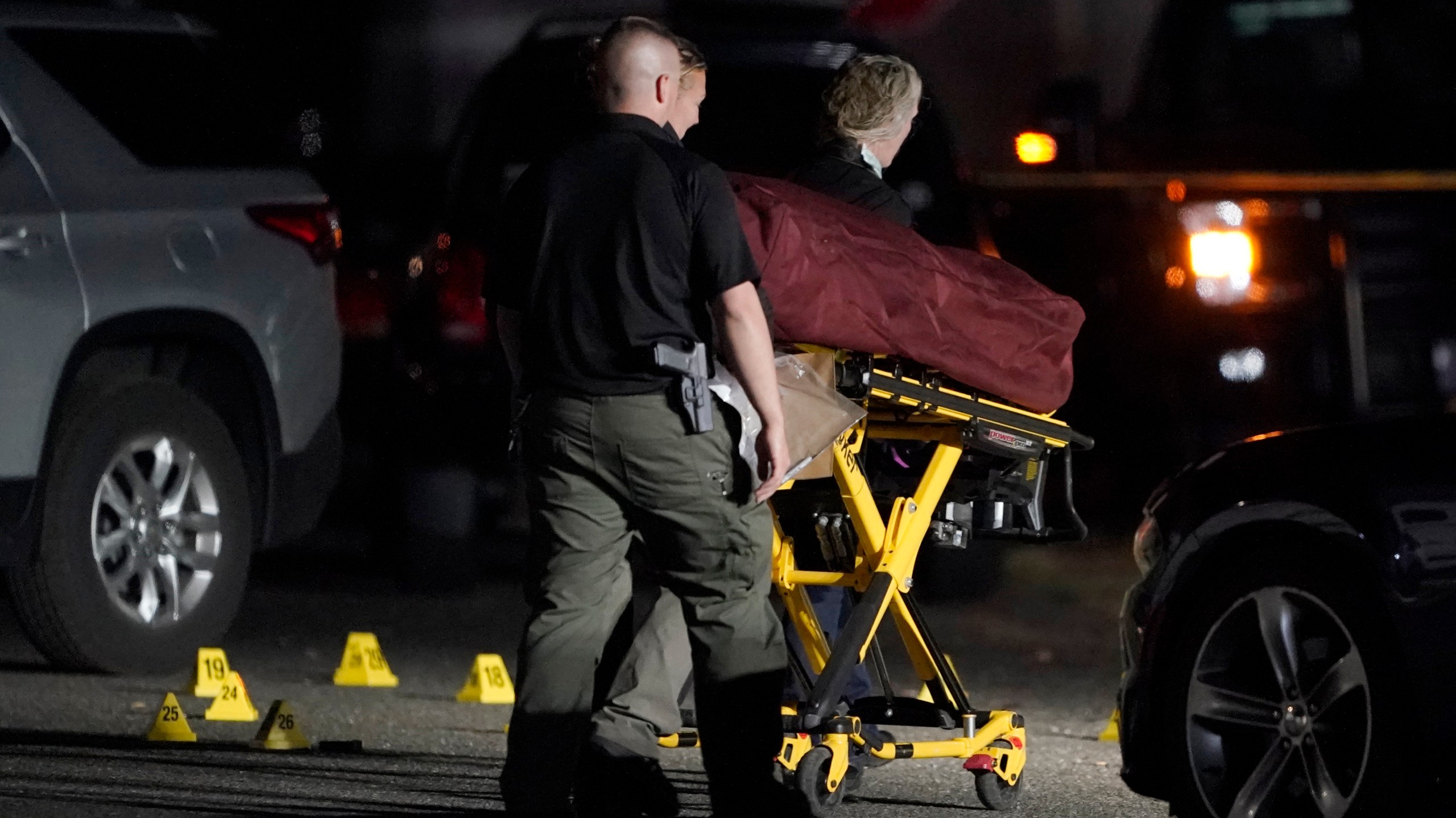 The body of Michael Reinoehl is taken away on a stretcher in the early morning hours of Sept. 4, 2020, in Lacey, Washington. (Ted S. Warren / Associated Press)